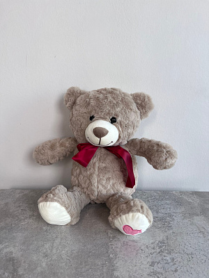 Мягкая игрушка: бежевый медвежонок с бантиком 30 см